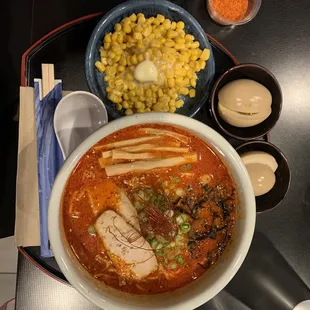 a bowl of ramen and corn