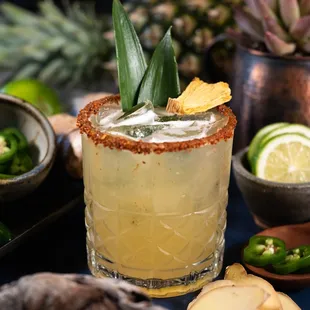 a cocktail with a pineapple garnish