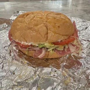 Ittalian Cold Cut Sandwich-Kaiser Roll w/ provolone, LTO, hot peppers, oil and vin, oregano and mayo.
