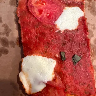 A slice of their Margharita pizza.