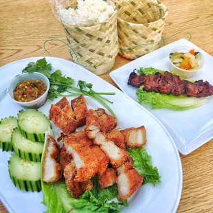 Deep fried pork belly with beef skewers and sticky rice