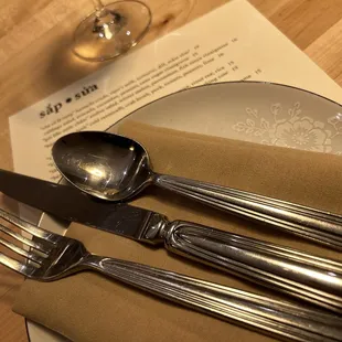 a place setting with silverware