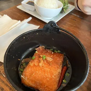 SALMON CLAY POT $16.95 Caramelized 8oz salmon filet, fried onion served w/steamed rice or brown rice and spring mix salad