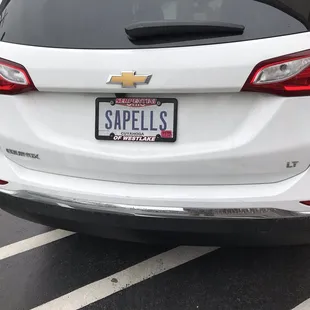 the back end of a white car