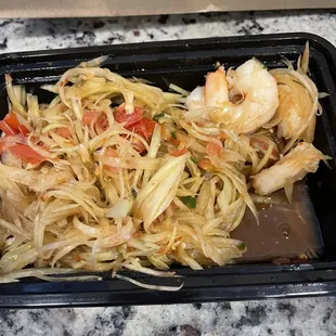This is Lao papaya salad that I paid $3 extra to add shrimp and only received 4 shrimp for $3 extra totaling a $12 dish.