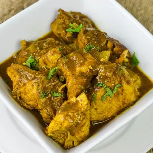 a bowl of curry with chicken