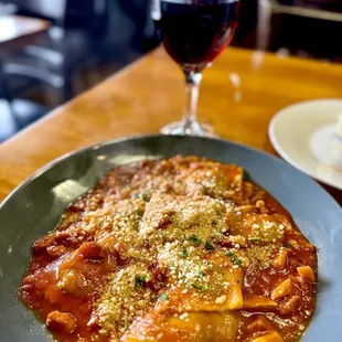 Spinach-ricotta-filled ravioli all'Amatriciana. And this is a split portion! Delicious creation off the menu.