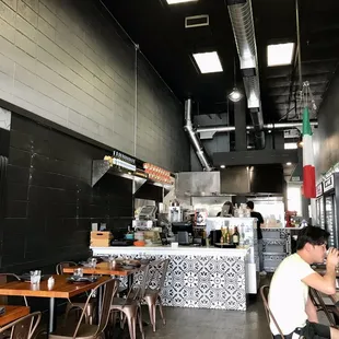 a man sitting at a table in a restaurant