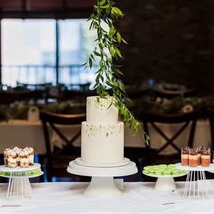a wedding cake and cupcakes