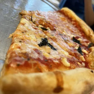 Medium cheese, pizza with fresh basil and feta cheese.