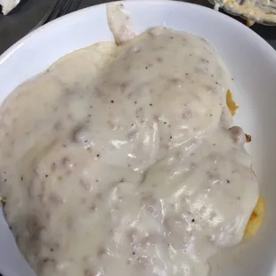 Biscuits gravy over eggs