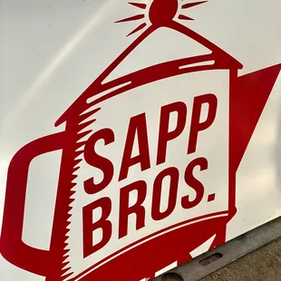 a red and white sign