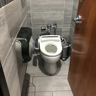 Very clean and new toilet with a bidet!