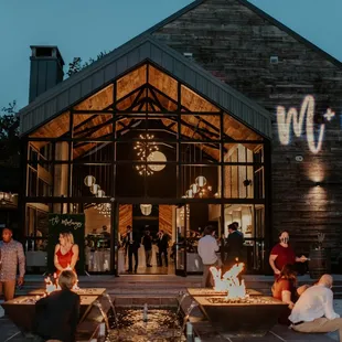 a group of people gathered around a fire pit