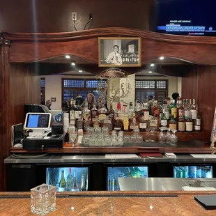 a bar with a television above it
