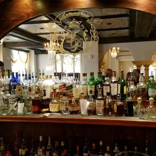 a bar with many bottles of alcohol