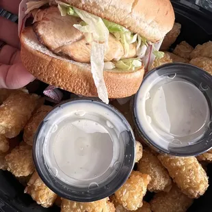 Grilled chicken sandwich and tots
