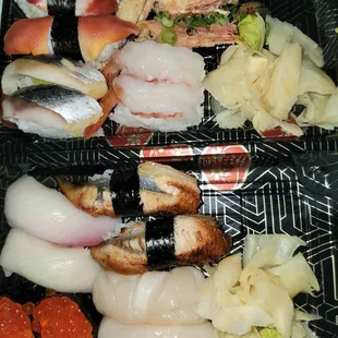 Variety of Nigiri: surf clam, yellow tuna, sweet shrimp, mackerel, eel, salmon roe, scallop.