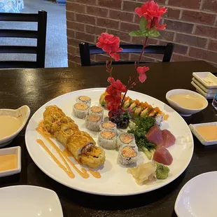 Our food presentation! Starting from the left: Crab Rangoon Roll, Spicy Crab Roll, Spring Roll, and sashimi tuna on the front!