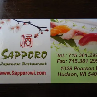 Business card with contact info.