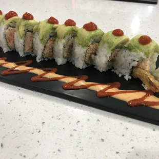  sushi roll on a black plate