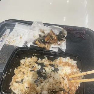 a tray of rice and chopsticks