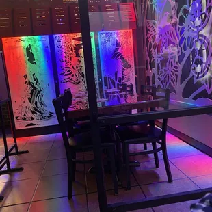 a table and chairs in a brightly lit room