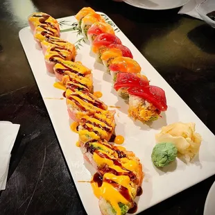 a long rectangular platter of sushi