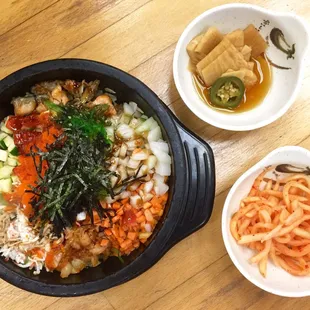 a bowl of vegetables and a bowl of rice