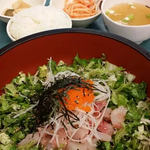 Sashimi Don with rice.  (Menu is in Korean and English).  More than enough sashimi, tea, soup, full bowl of rice, two sides, $10