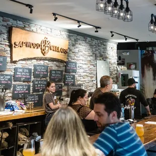 customers sitting at the bar