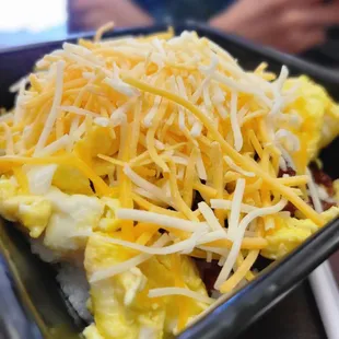 a plate of scrambled eggs and cheese