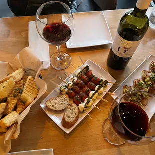 From left to right: Focaccia Garlic Bread, Caprese Skewers, Avocado Bruschetta and C. Tollo - Montepulciano '17 - Abruzzo, Italy