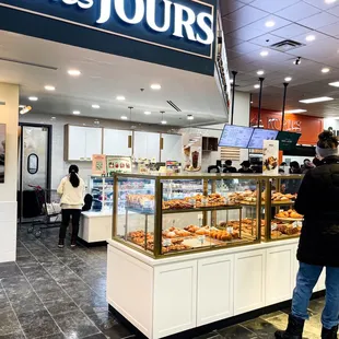 a woman standing in front of the counter