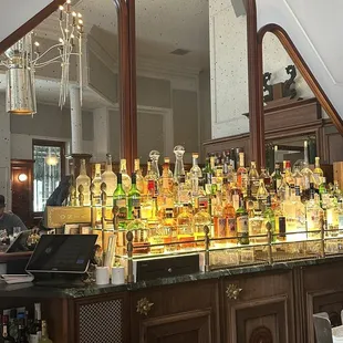 a bar with a lot of liquor bottles