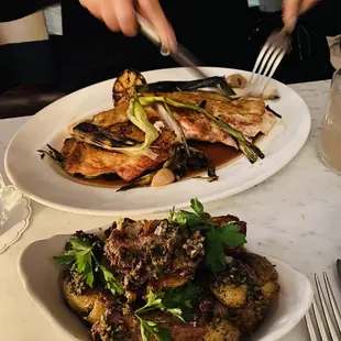 a plate of grilled fish