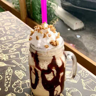 a chocolate milkshake in a mason jar