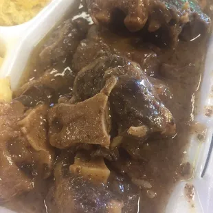 Oxtails and gravy over rice