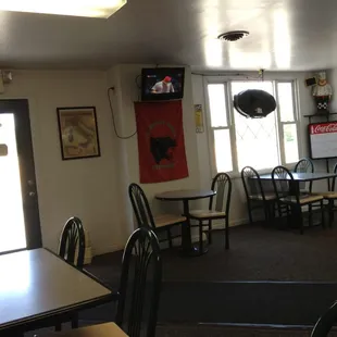 a dining area with tables and chairs