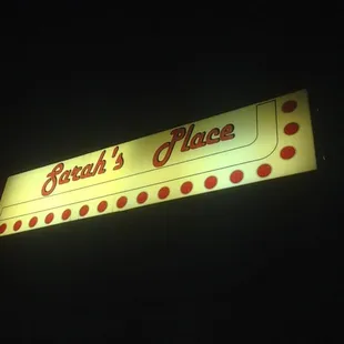 a neon sign in the dark