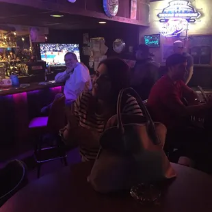 people sitting at a bar