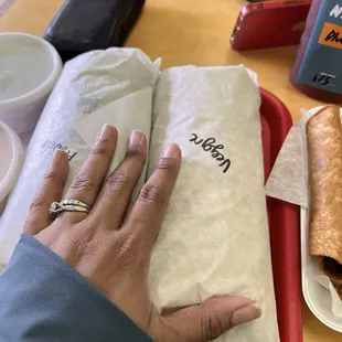 Giants burritos. Ask them to cut it in half. You will have lunch and dinner.