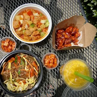 a table with bowls of food and drinks