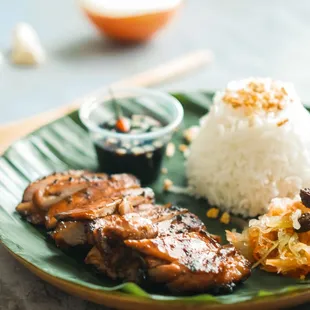 BBQ Boneless Chicken thigh served with rice, signature sauce and Atchara(pickled papaya).