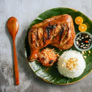 Chicken Inasal served with rice, signature sauce and Atchara(pickled papaya).