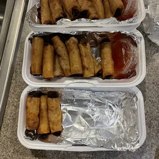 Lumpia, adobo, rice, pancit, bbq pork skewers