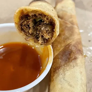 a roll with meat and sauce