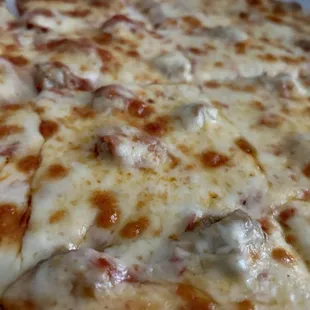 Thin crust sausage pizza