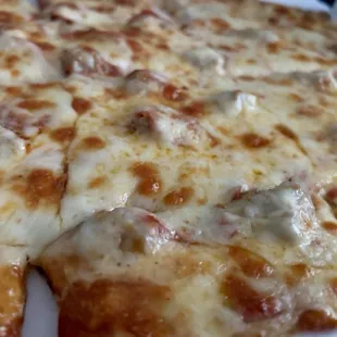 Thin, crushed sausage pizza