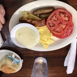 Sara's special w/ scrambled eggs, grits, and a side of tomato
